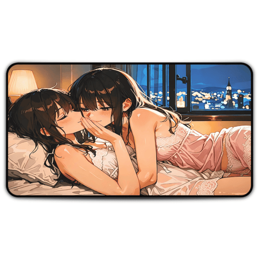 Lewd anime girls laying together in bed on this sensual sleepover desk mat